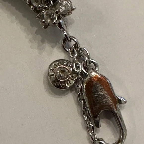 Gorgeous HENRI BENDEL Sparkly Rhinestone, Silver Infinity Bracelet - Picture 5 of 11